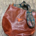 Custom embroidered leather purse featuring Longhorn logo design